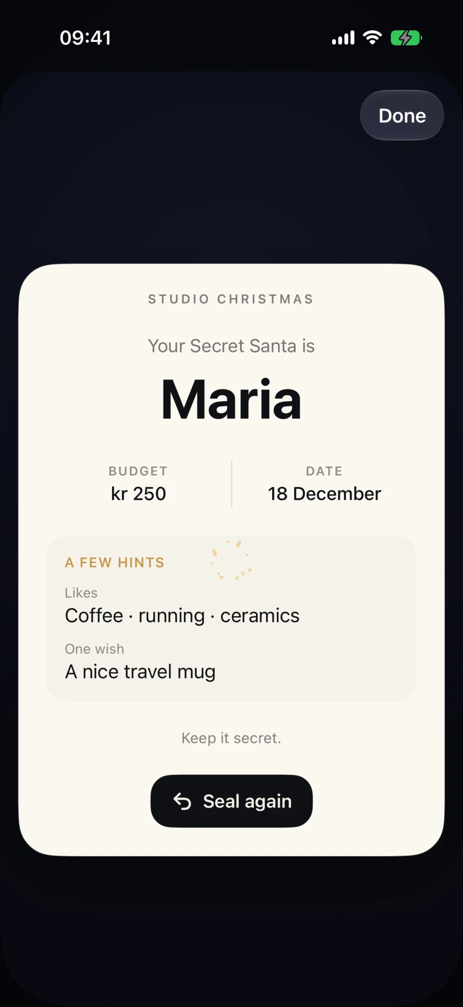 A revealed warm-paper Secret Card naming Maria with budget, date and gift hints